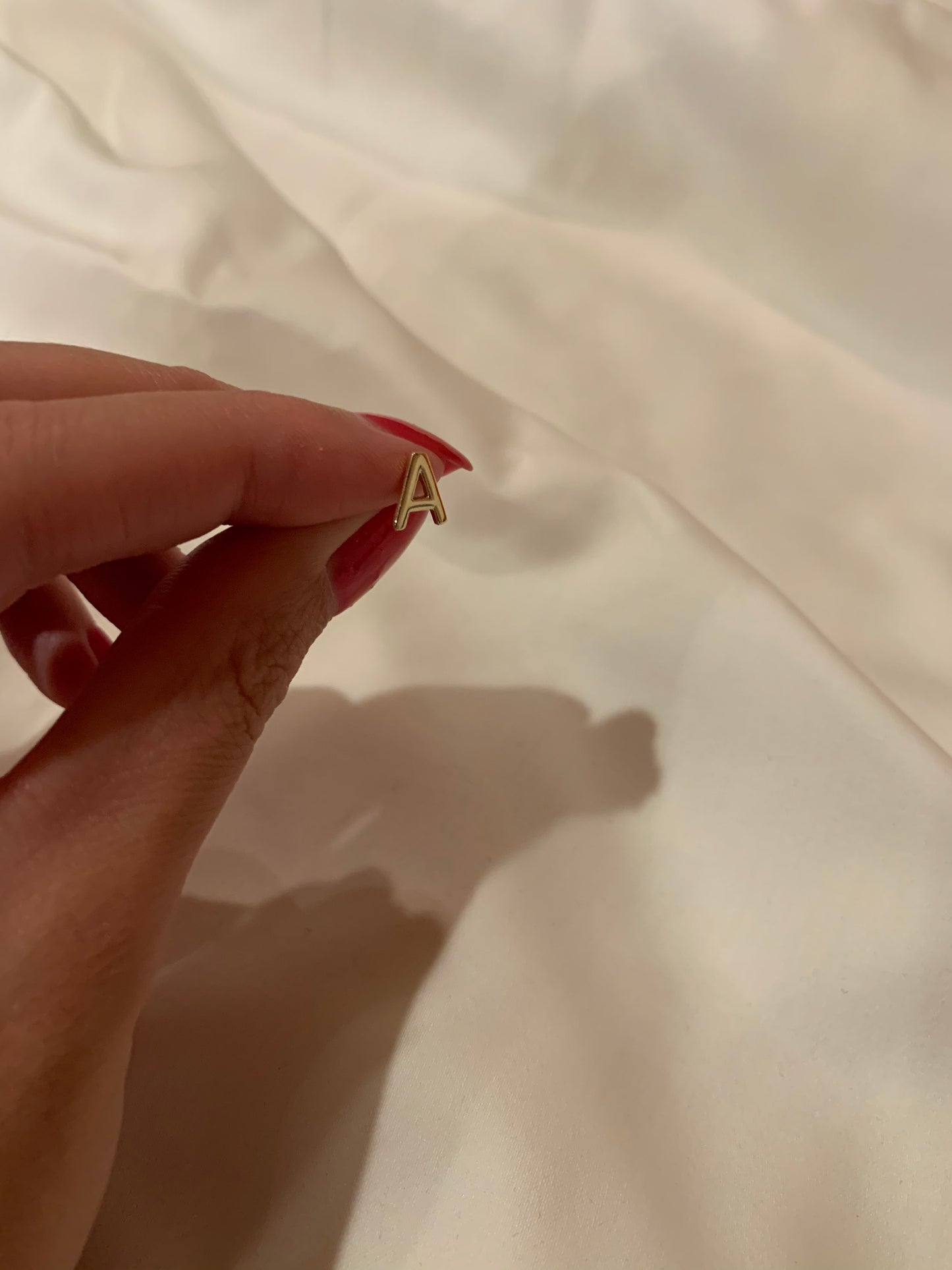 INITIAL EARRING(S)